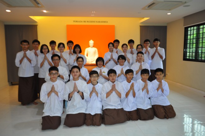 The Dhamma School students having a group photograph with their teachers after the examination.