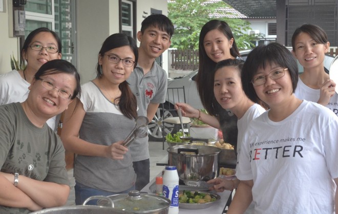 Many hands make light work for participants  preparing for their barbecue-cum-steamboat dinner.