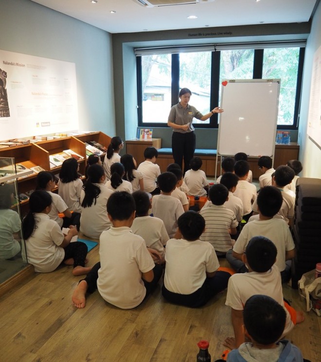 Sis. Sadhika giving a short Dhamma sharing to the children, aged 10 to 12.