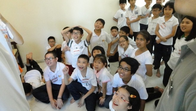 Junior Dhamma School students learning happily.