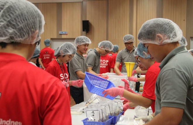 Youths helping to pack food parcels at the event.