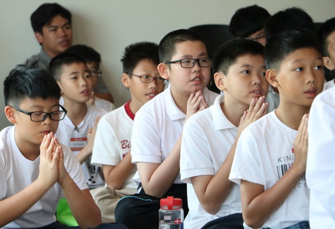 Dhamma School students attend Service Sunday before class.