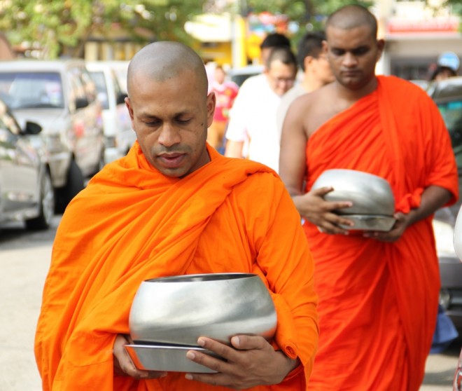 Venerable monks on alms-round at Overseas Union Garden (O.U.G.) and Happy Garden morning markets.