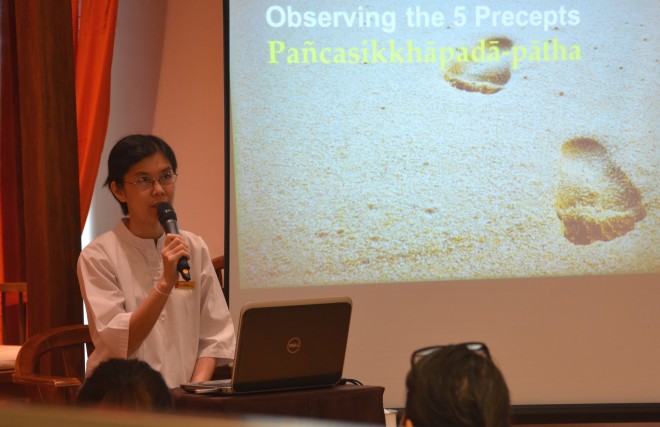 Sis. Santi Cheang giving a talk on ‘Observing the 5 Precepts.' 