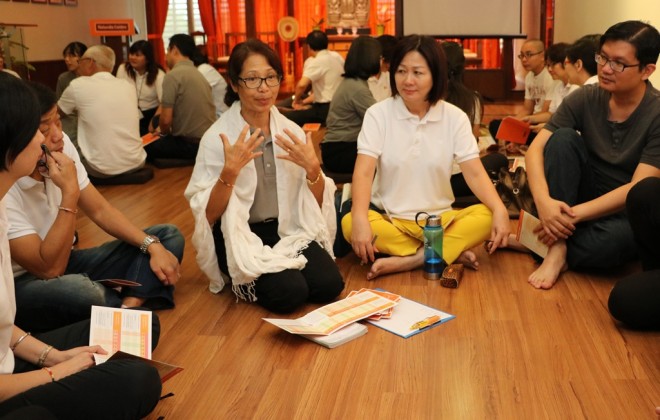 Participants have interesting group discussions following the Dhamma talk.