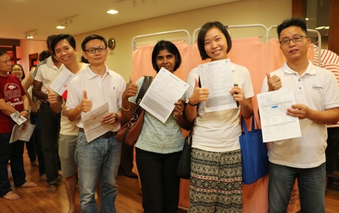 Joyful devotees queuing up to donate blood at this year's Wesak Observance.