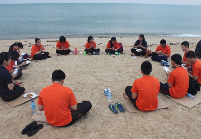 Resting and reflecting on Dhamma at the beach.