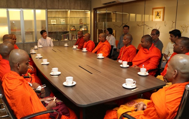 Bro. Tan briefing the venerables on educational programmes organised by Nalanda Society, Institute, and Dhamma School.