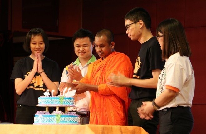 Venerable Rahula cutting a special cake to mark the golden anniversary of the society.