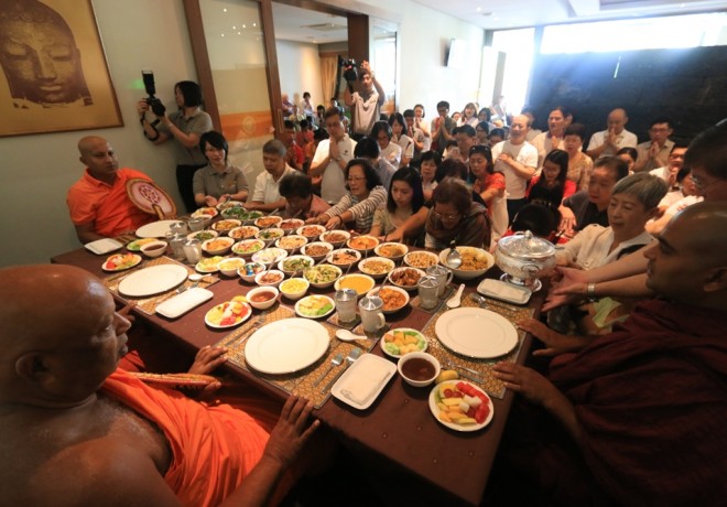 Offering lunch to monks.
