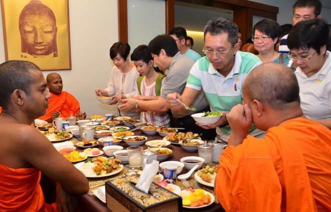 Devotees also get the opportunity to offer food to venerable monks.