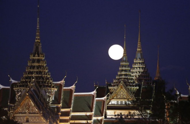 'Supermoon' rising over the Grand Palace in Bangkok.