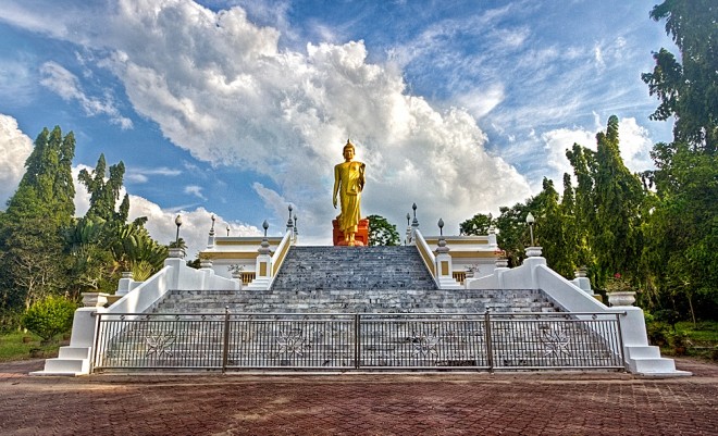 Standing Buddha image at Wat Phikulthong Vararam.
