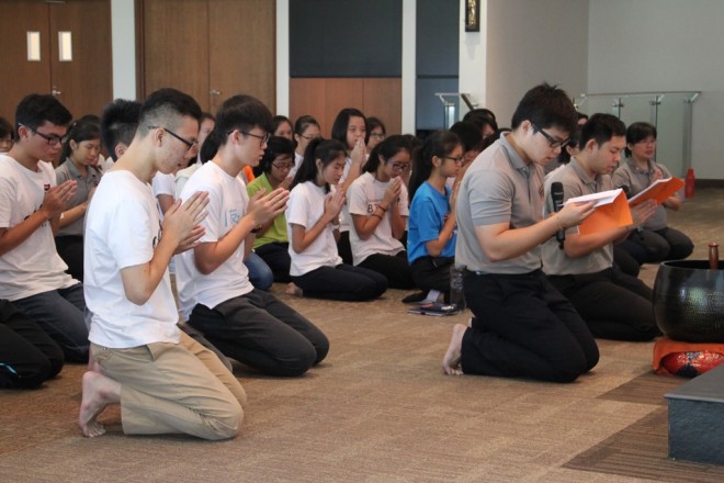 Participants observe meditation and chanting.