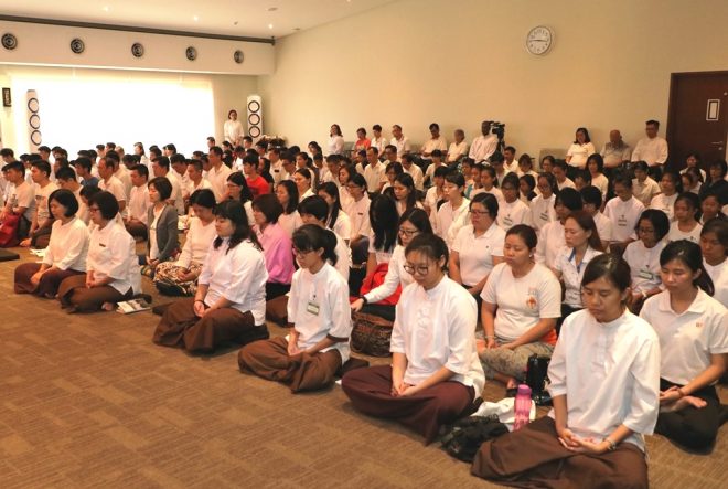 The congregation taking part in meditation and chanting