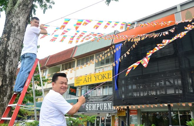 Decking the building with Buddhist flags.