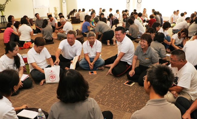 Devotees enjoying group discussion and dynamic learning last year.