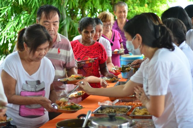 Generous devotees offering free food to the public on Wesak Day.