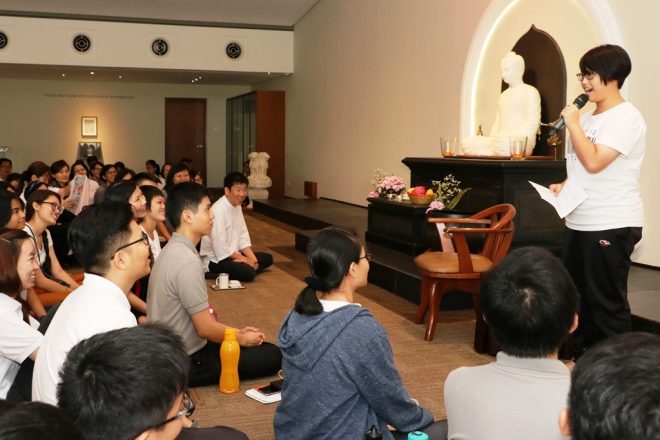 Volunteers took turns to share their experience over Wesak.